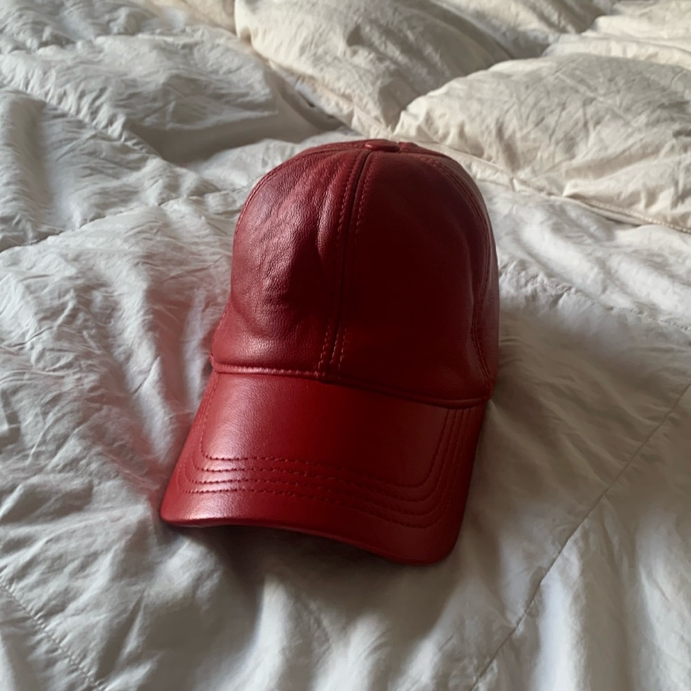 Red leather hat. One size fits all.  Like new. Hardly used